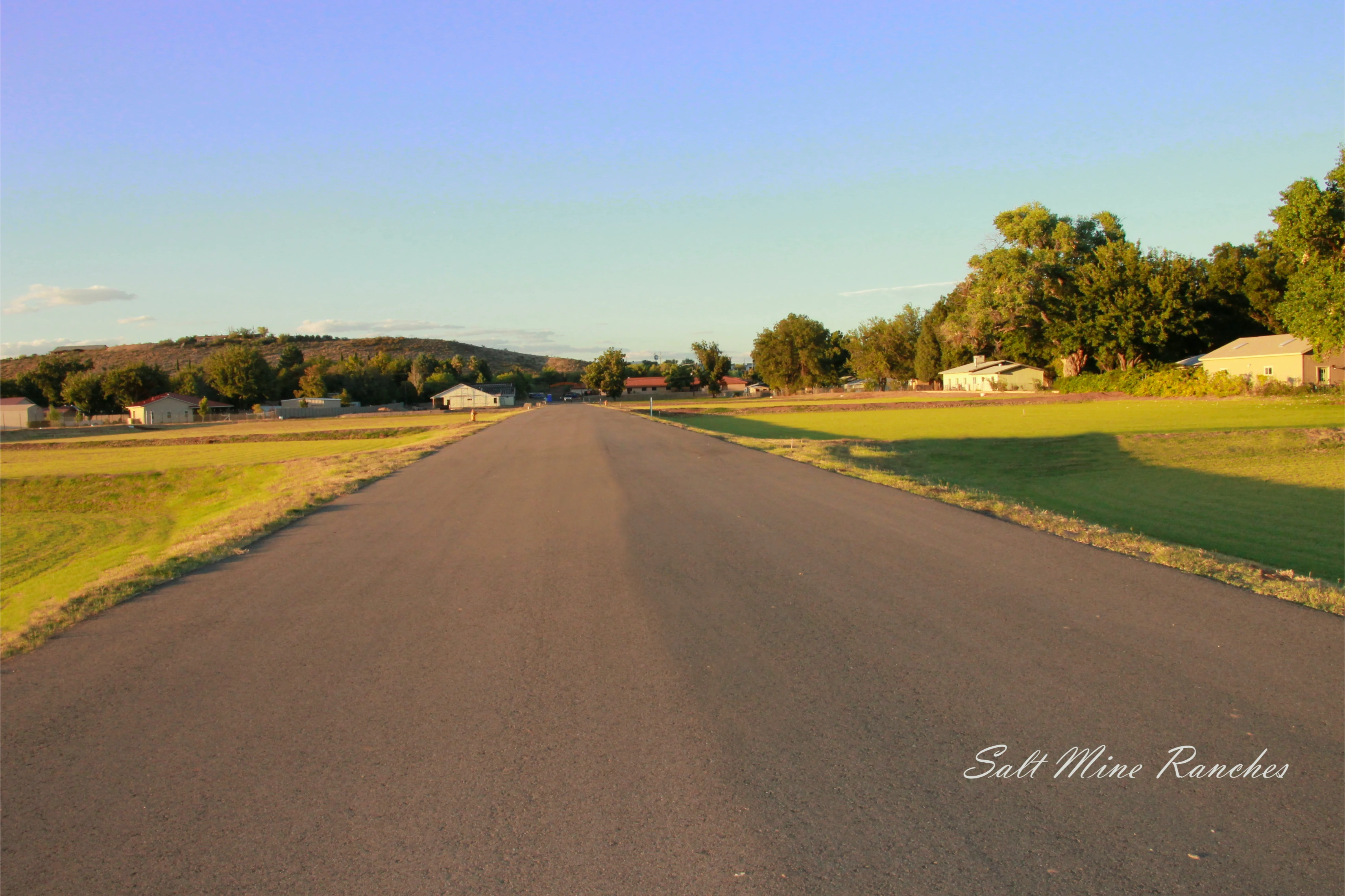 Ground view of saltmine ranches with paved road